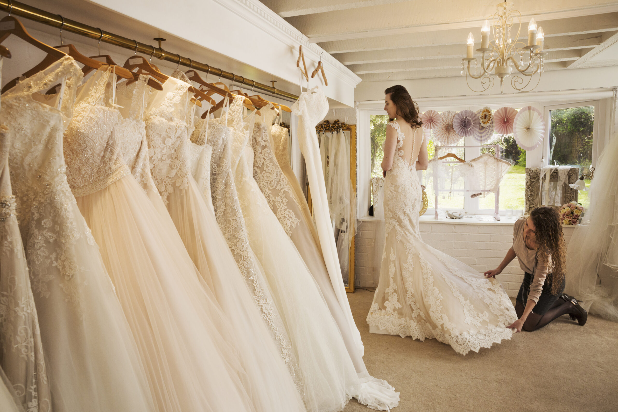 Rows of wedding dresses on display in a specialist wedding dress shop.,Wedding Dress Shop,England Rows of wedding dresses on display in a specialist wedding dress shop ,Wedding Dress Shop,England